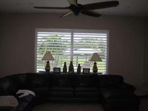 Wide living room plantation shutter installation for a St. Augustine homeowner